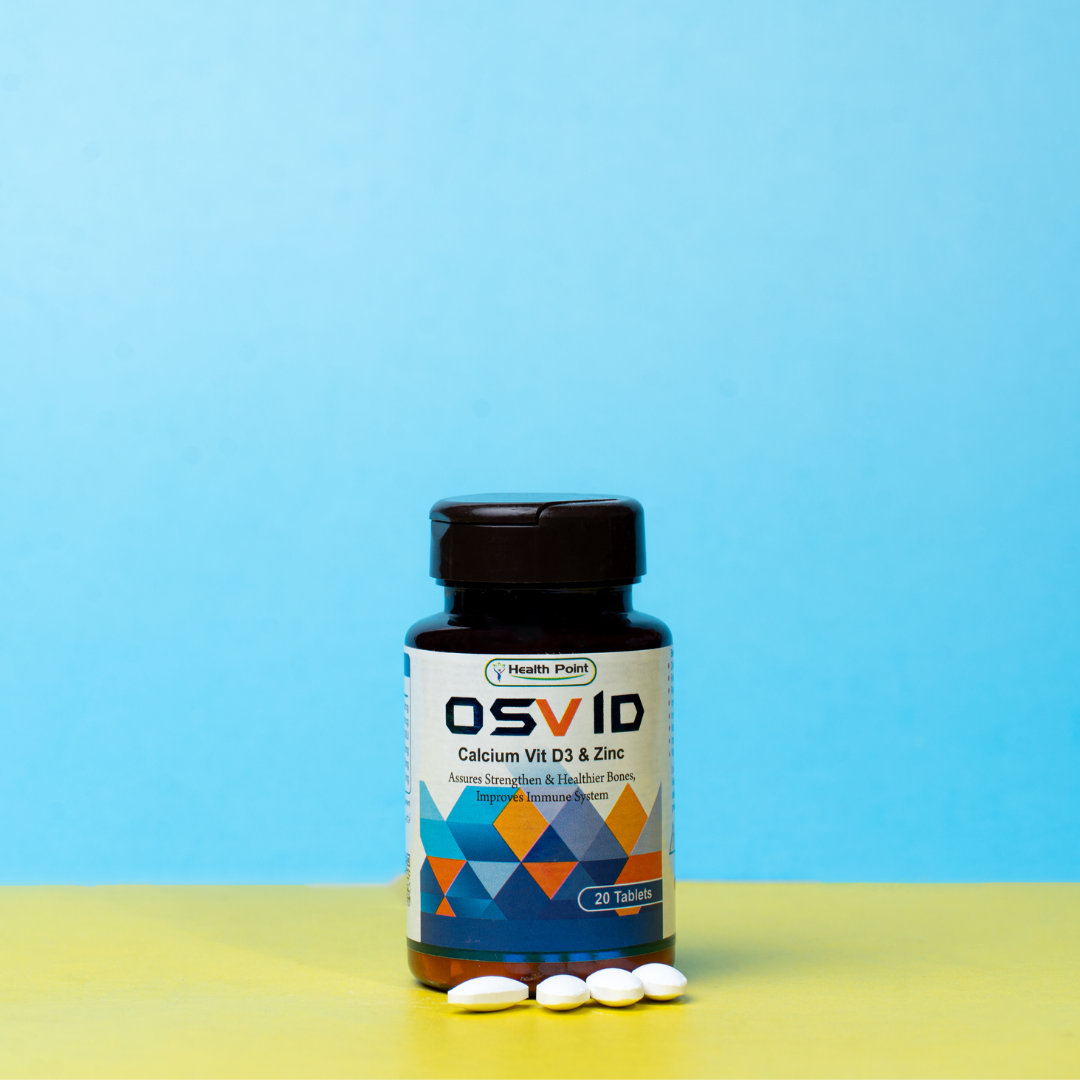 A bottle of OSVID Calcium and its tablets placed on table.