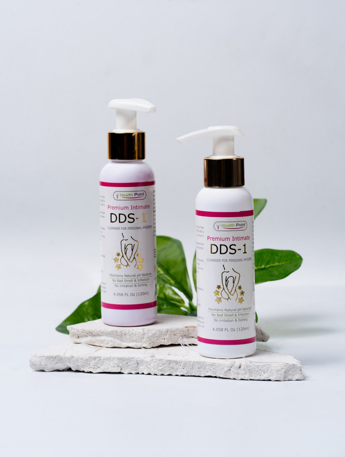 A white bottle of DDS-1 premium intimate cleanser with a clean leaf in the background.